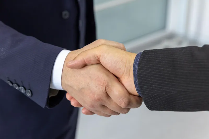 A Grip and a Promise: The American Business Deal Before the Contract Arrived